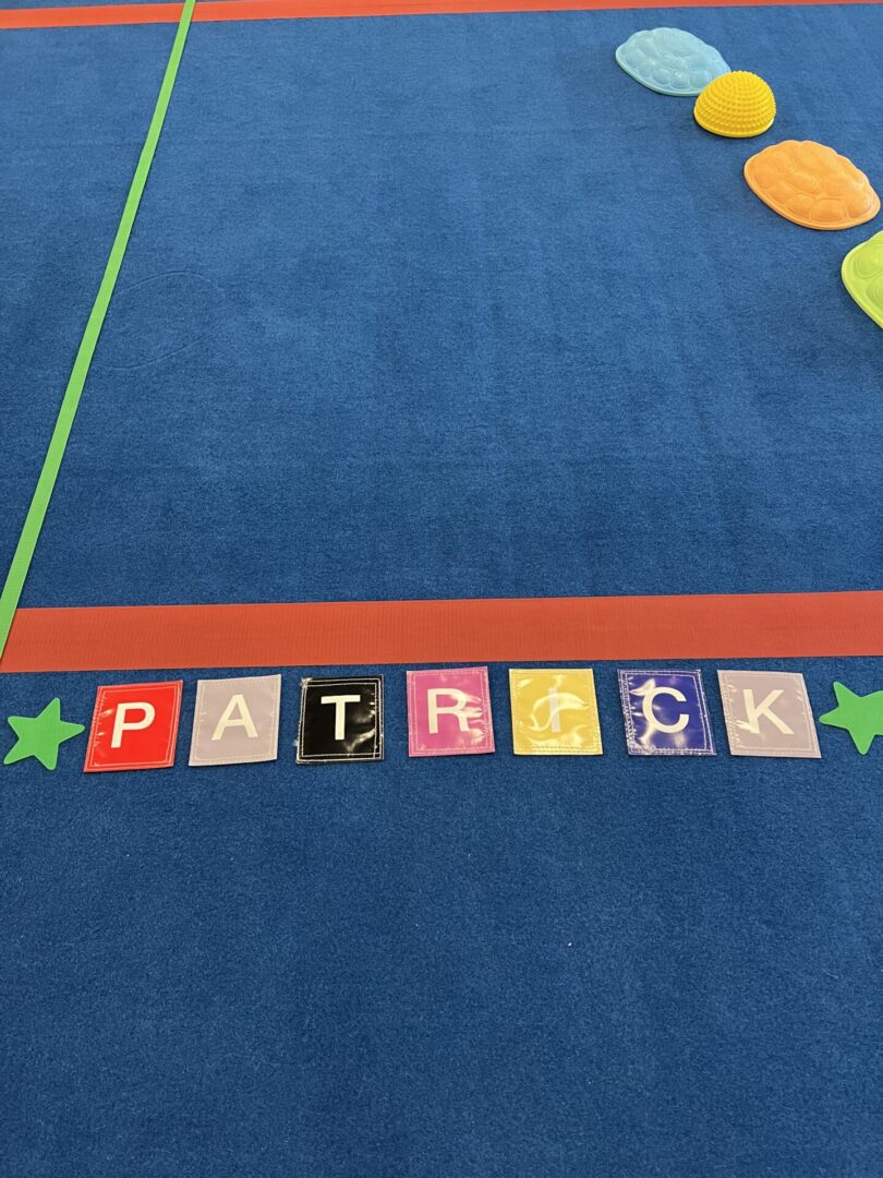 Patrick word on the mat with letters